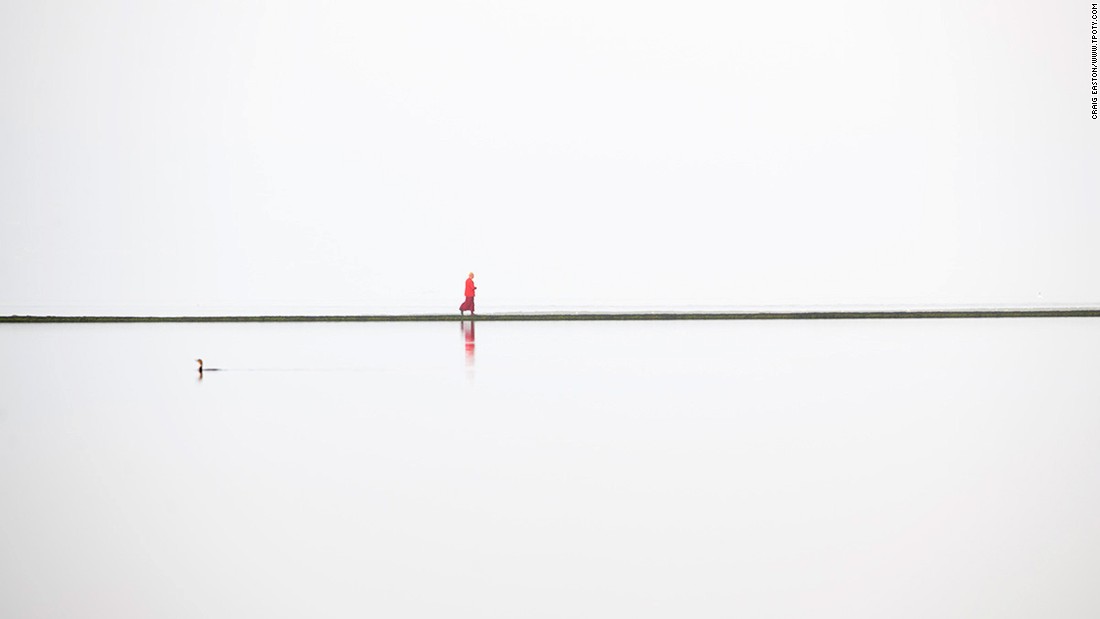 The Wirral Peninsula in the northwest of England is the scene of this unusual image taken by Craig Easton. It shows a lone Buddhist monk walking around the boundary wall of a lake. Easton's series of images from the Wirral earned him the top prize in the Land, Sea, Sky portfolio category.