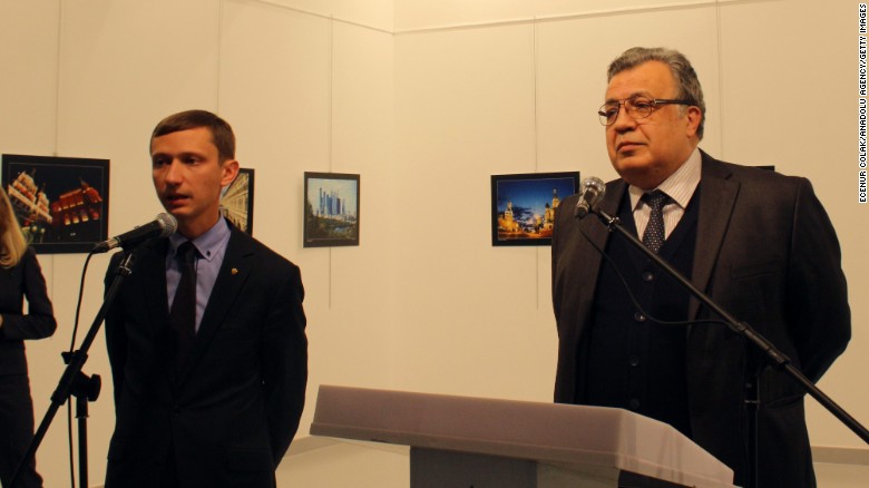 Andrey Karlov, Russia's ambassador to Turkey, right, was giving a speech in Ankara, Turkey, when he was shot.