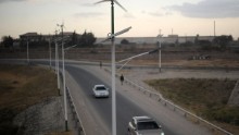Street lamps powered by wind and solar energy line the side of a road close to the Kenyan capital Nairobi. Kenya is making a priority of wind, notably through the Lake Turkana Wind Power Project that will be the largest in Africa with a capacity of 310 MW.