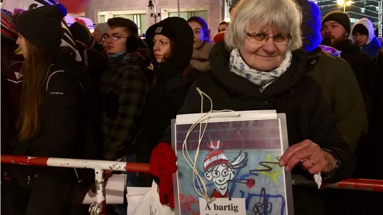Irmela Schramm, 70, was demonstrating on the pro-refugee side. She has traveled around Germany for years, painting over neo-Nazi graffiti with heart shapes.