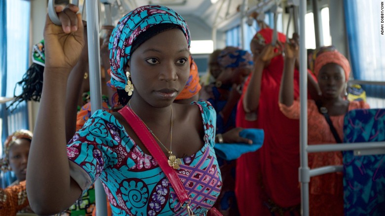 The girls ride on a bus in Abuja on their way to the airport in the first leg of their journey home. 