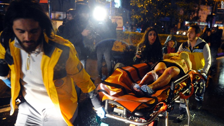 Medics carry a wounded person at the scene after an attack at a popular nightclub in Istanbul, early Sunday, Jan. 1, 2017. Istanbul Governor Vasip Sahin said that an armed assailant has opened fire at a nightclub in Istanbul during New Year&#39;s celebrations. Turkish authorities have banned distribution of images relating to the Istanbul attack within Turkey.(IHA via AP)