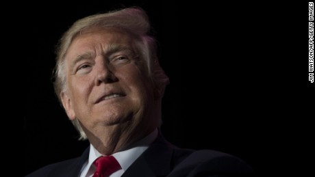 US President-elect Donald Trump looks on while speaking during a &#39;Thank You Tour 2016&#39; rally in Orlando, Florida on December 16, 2016. / AFP / JIM WATSON        (Photo credit should read JIM WATSON/AFP/Getty Images)