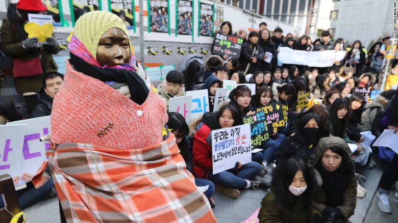 Students gather near a &quot;comfort woman&quot; statue during a rally in front of the Japanese Embassy in Seoul, South Korea for a weekly &quot;Wednesday demonstration&quot; on January 11, 2017.