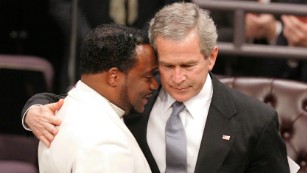 President George Bush hugs Bishop Eddie Long during Coretta Scott King&#39;s 2006 funeral.