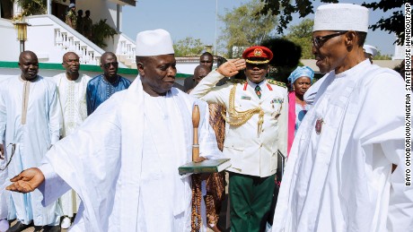 Jammeh, left, meets with Nigerian President Muhammadu Buhari on Friday in Gambia&#39;s captial, Banjul.