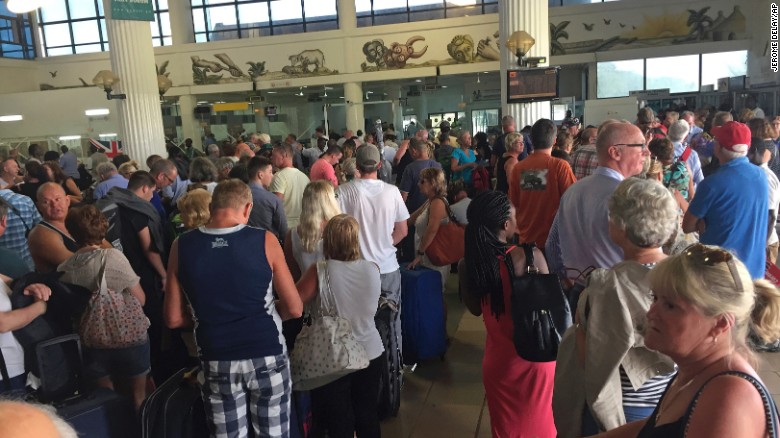 Tourists gather at the airport in Banjul as tour operators send in extra flights to evacuate them Wednesday January 18.