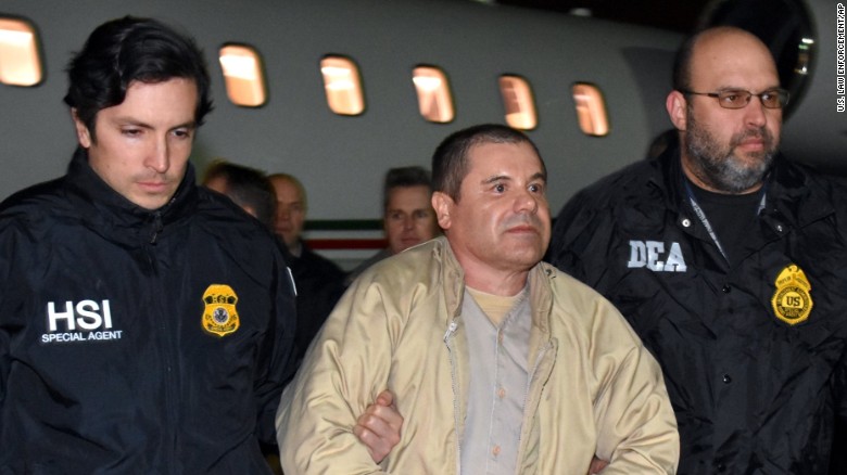 &quot;El Chapo&quot; is escorted from a plane to a waiting caravan of SUVs at Long Island MacArthur Airport before being transferred to a Manhattan jail.