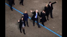 Vice President Mike Pence, center, waves to supporters as he walks with his family during the Presidential Inaugural Parade.