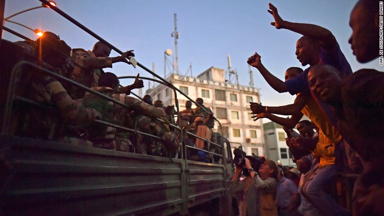 Citizens celebrate the arrival of  troops after the former President Yahya Jammeh fled the country.