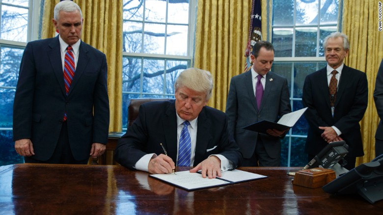 Trump signs an executive order to withdraw the US from the 12-nation Trans-Pacific Partnership trade pact. 