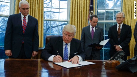 Trump signs an executive order to withdraw the US from the 12-nation Trans-Pacific Partnership trade pact. 