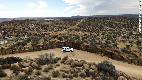 A US Border Patrol vehicle stands guard along the US-Mexico border on September 26, 2016, in Jacamba Hot Springs, California. According to a Congressional Research report, the first fencing was constructed near San Diego in 1990. 