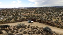 A US Border Patrol vehicle stands guard along the US-Mexico border on September 26, 2016, in Jacamba Hot Springs, California. According to a Congressional Research report, the first fencing was constructed near San Diego in 1990.