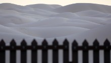 This 15-foot border fence that sits atop sand dunes at the Imperial Sand Dunes in California is known as the "floating fence." It moves with the sand as winds shift. According to Border Patrol agents, immigrants and drug smugglers attempt to cross here daily.
