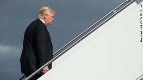TOPSHOT - US President Donald Trump boards Air Force One at Andrews Air Force Base in Maryland on January 26, 2017 as he departs to attend a Republican retreat in Philadelphia. / AFP / NICHOLAS KAMM        (Photo credit should read NICHOLAS KAMM/AFP/Getty Images)