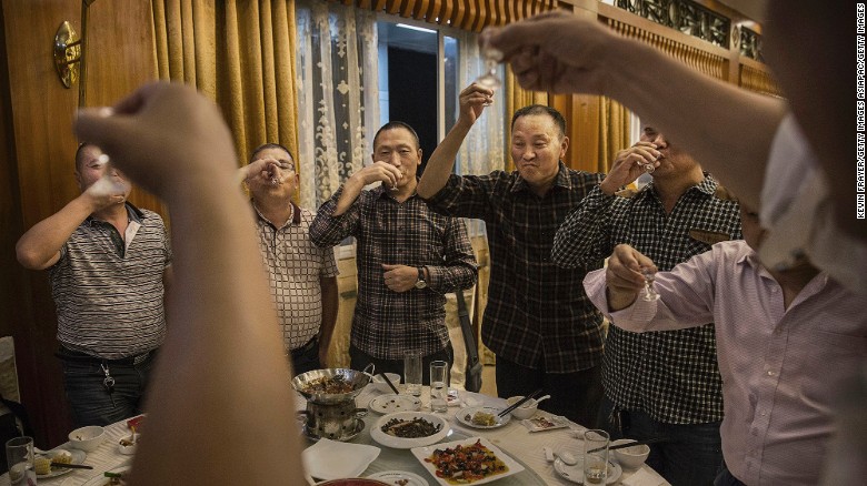 <strong>Moutai: </strong>Chinese men toast each other as they drink Moutai, the most famous brand of baijiu. Distilled from sorghum and rice, the spirit is the tipple of choice for everything from wedding receptions to business banquets.  