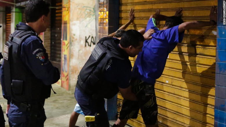 Municipal guards search suspects.