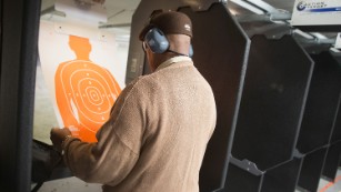 A man practices his marksmanship skills at the Metro Shooting Supplies range in 2014 in a suburban St. Louis store near Ferguson, Missouri. 