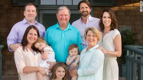 Retired Texan executive John Washburn (C) with his family.