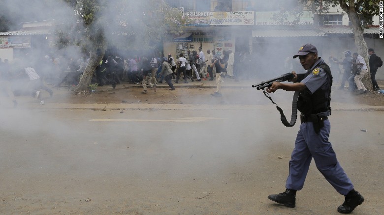 Police forces shot rubber bullets at crowds during a march. Local South African residents have been attacking foreign-owned shops in the city this week, looting goods. 