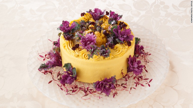 This next-level cake, flavored with pumpkin, has broccoli, cauliflower, beets and purple sweet potato inside, wrapped in yellow cauliflower, purple petit veil and amaranth sprouts.