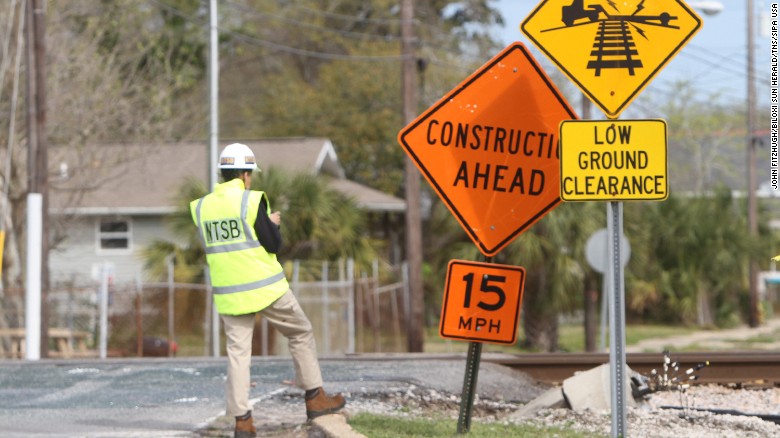 This is the Main Street railroad crossing in Biloxi. A &quot;low ground clearance&quot; sign warns drivers of the potentially hazardous hump ahead.