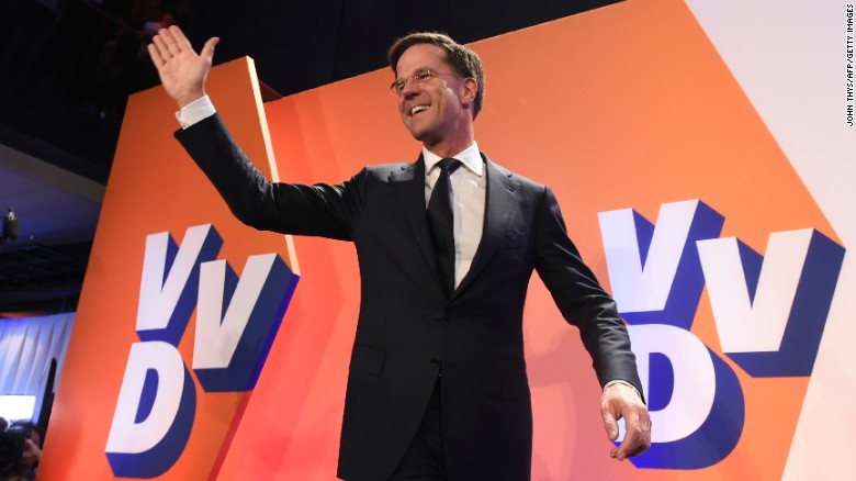 Netherlands&#39; Prime Minister Mark Rutte celebrates after exit polls put him in first place.