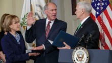 Vice President Mike Pence, right, administers the oath of office to Dan Coats, the new director of national intelligence, on Thursday, March 16. Coats was accompanied by his wife, Marsha. He was confirmed by the Senate the day before.