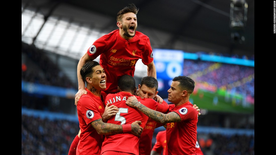 Liverpool players celebrate after James Milner&#39;s goal against Manchester City on Sunday, March 19. The Premier League match ended 1-1 in Manchester, England.