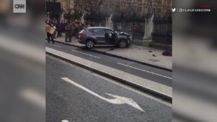 Crashed car smokes outside Parliament