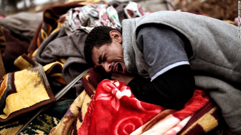 A man breaks down in tears after a dozens were killed in Mosul on March 17. 