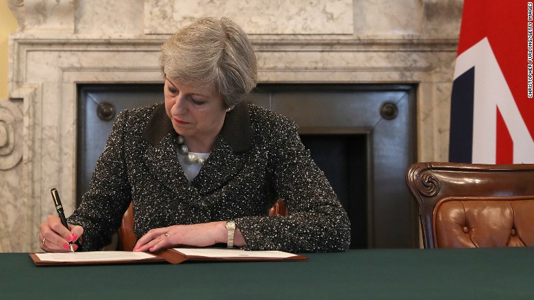 British Prime Minister Theresa May signs the letter invoking Article 50 on Tuesday.