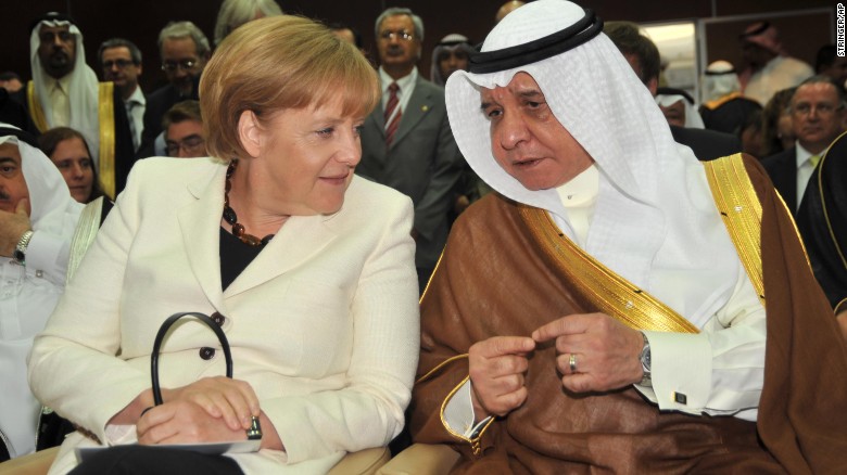 German Chancellor Angela Merkel speaks with Abdullah Alireza, minister of commerce and industry of Saudi Arabia.
