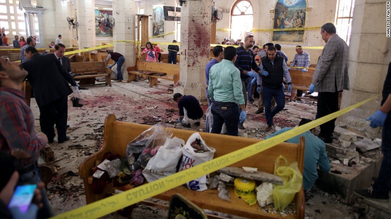 Security personnel survey the scene of a bomb blast at St. George's Church in Tanta, Egypt, on Palm Sunday. 