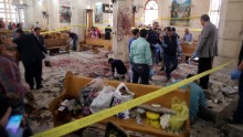 Security personnel investigate the scene of a bomb blast at St. George's Church in Tanta, Egypt, on Palm Sunday.