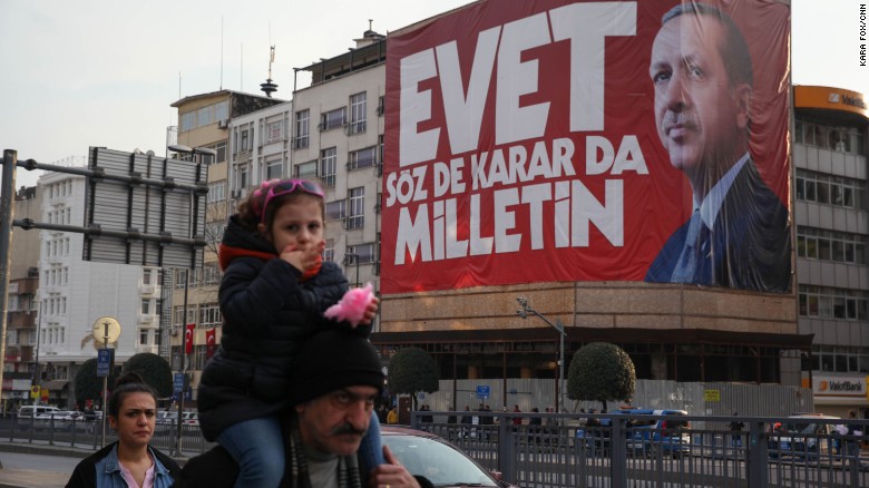 Istanbul residents walk past &quot;Yes&quot; campaign signs in the city center on Saturday, April 8, 2017.  