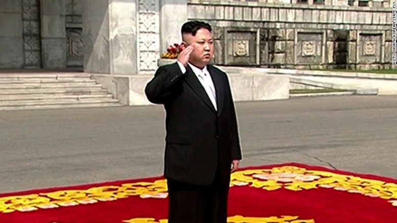 Kim Jong Un walks on the red carpet before the parade. 