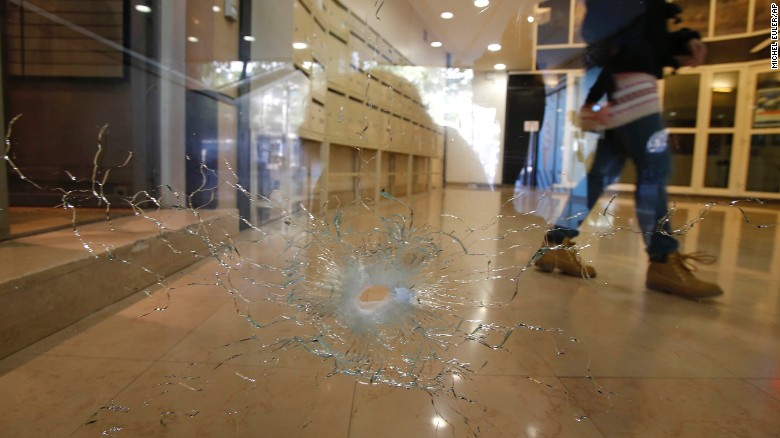 A damaged window is pictured on the Champs Elysees boulevard in Paris early Friday.