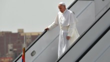 Pope Francis disembarks from his plane after arriving in Cairo.