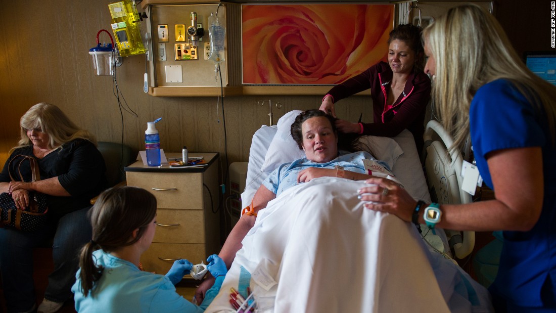Jessica is surrounded by friends, family and hospital staff shortly before her C-section on April 20. 