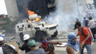 Armored military vehicle runs over Venezuelan protester