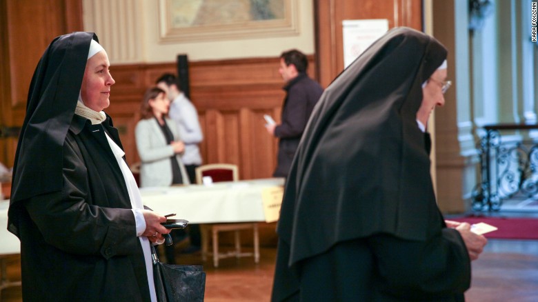 Nuns from the Benedictine Sisters of the Sacred Heart in Montmartre cast their votes at a polling station in the 18th district of Paris. 