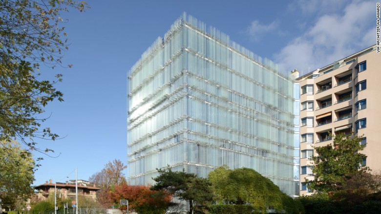 Laminated glass blades comprise the facade of the new headquarters of the Société Privée de Gérance (SPG) in Geneva. The reflections and transparencies of the building create a visual blurring effect.