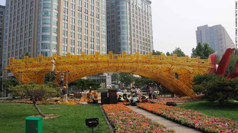 Workers prepare the &quot;Silk Road Golden Bridge&quot; in Beijing for the upcoming Belt and Road Forum.