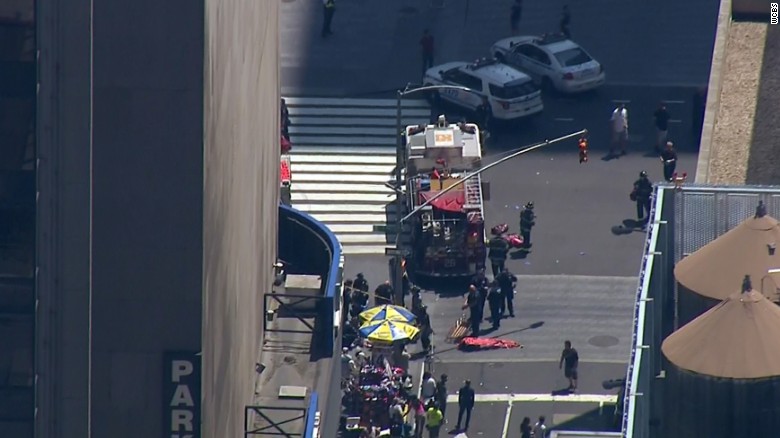Authorities scramble Thursday after a car crashes into a crowd in New York's Times Square. 