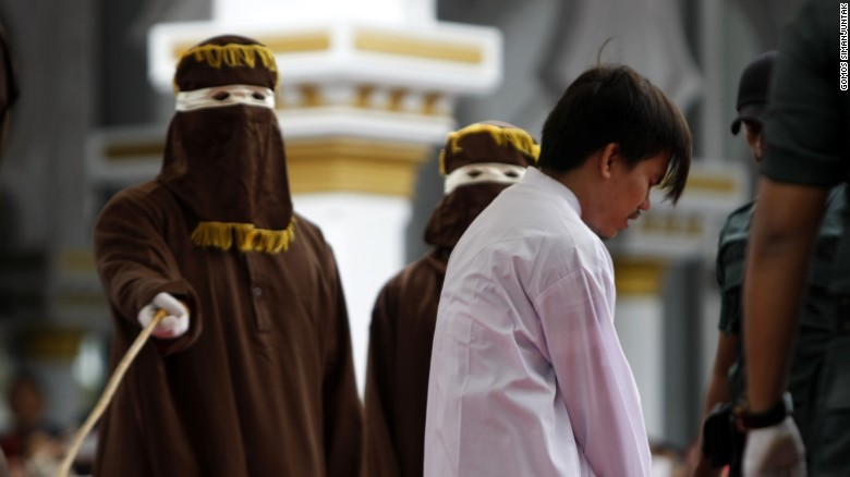 Asian men caned