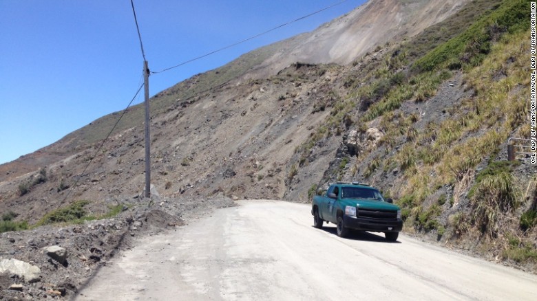 Saturday&#39;s Mud Creek slide left a pile of earth about 35 to 40 feet high covering the highway.