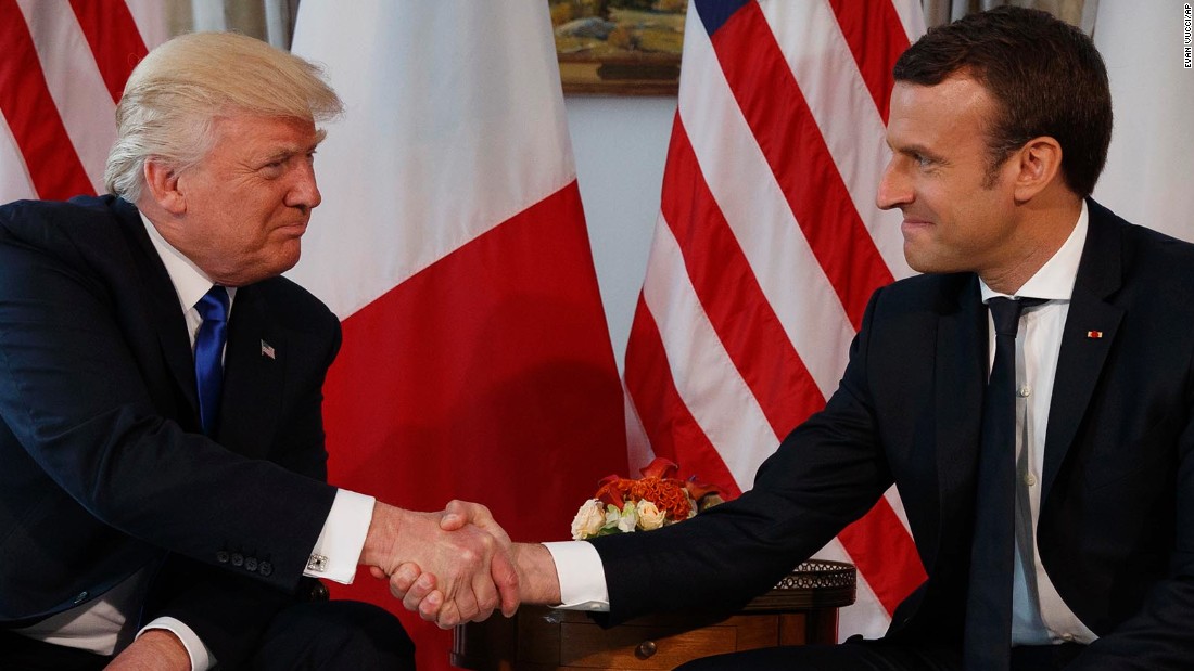 Image result for hd images of emmanuel macron handshake with trump