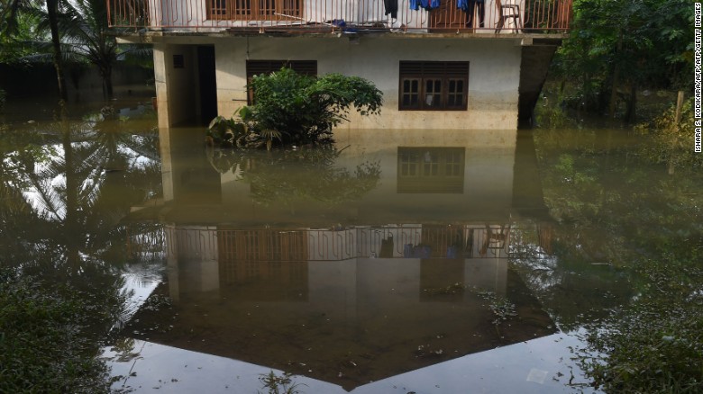A Sri Lankan home is surrounded by floodwaters in the suburb of Kaduwela in the capital, Colombo.